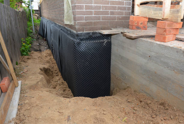 Happy homeowners after waterproofing job in Miller City